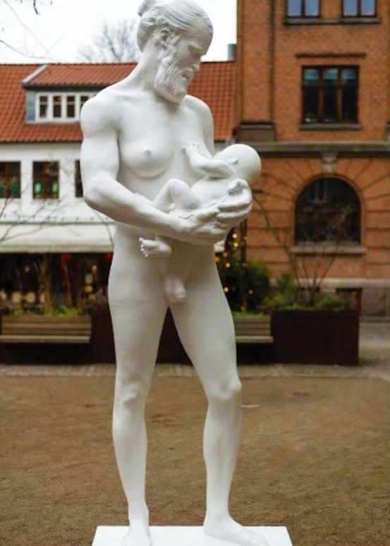 man breastfeeding statue